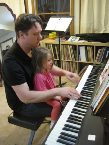 1-31-13 M and Dad play piano